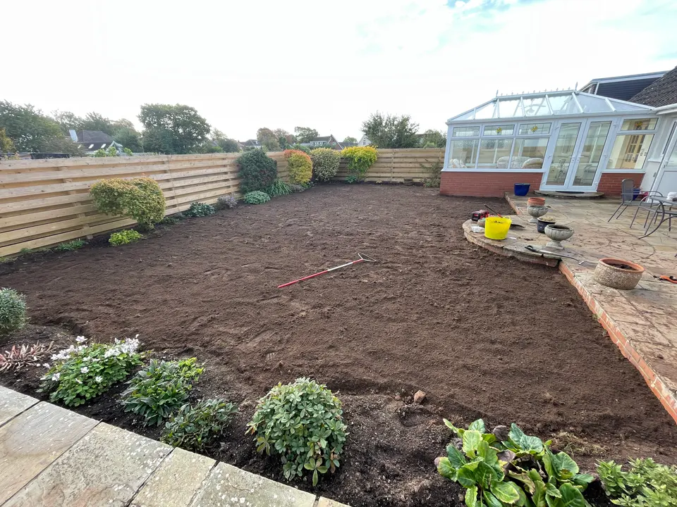Bare soil raked in preparation for fresh turf